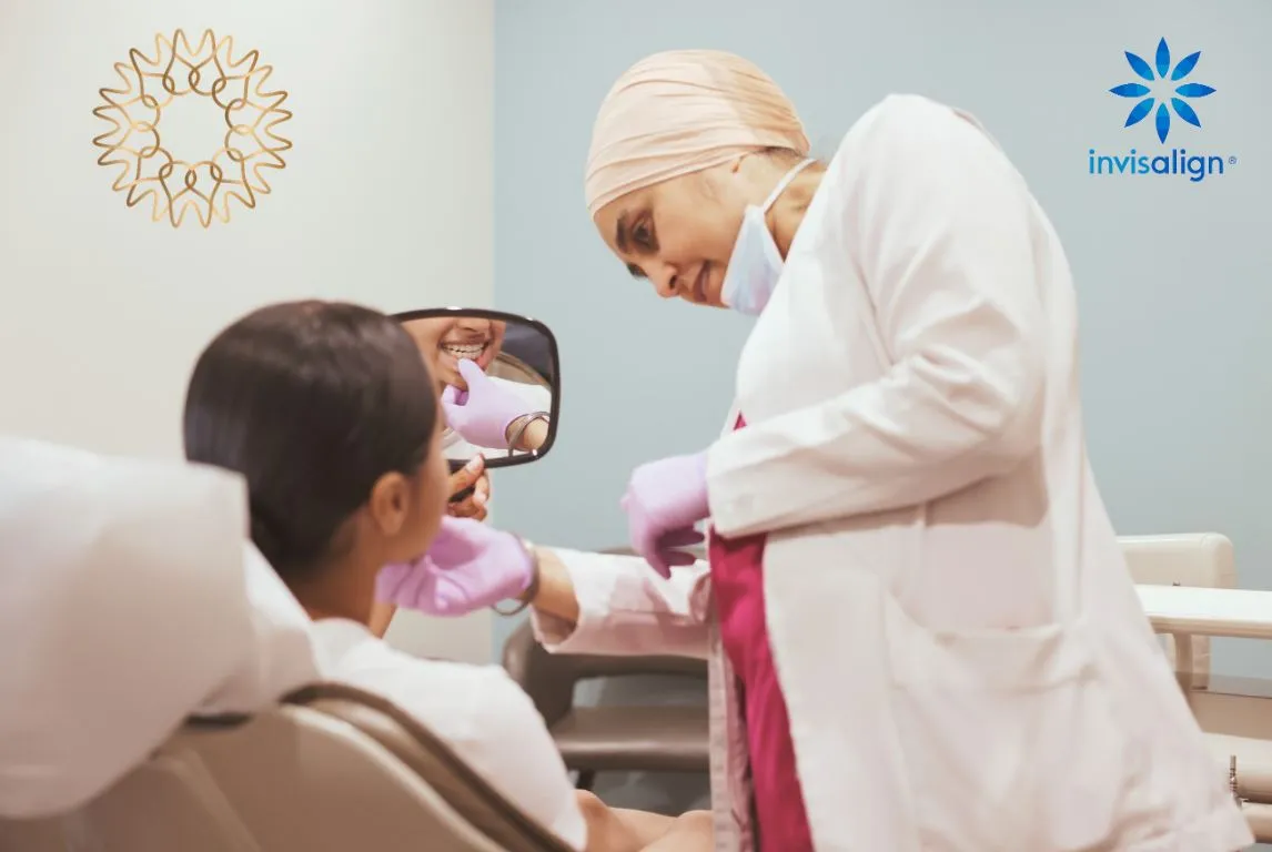 A patient seeing her new smile in a mirror during an Invisalign consultation